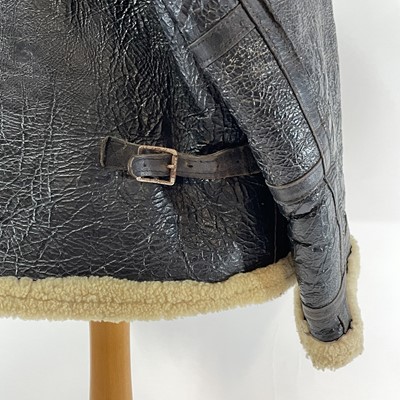 Lot 93 - A Second World War RAF black leather and sheepskin flying jacket.