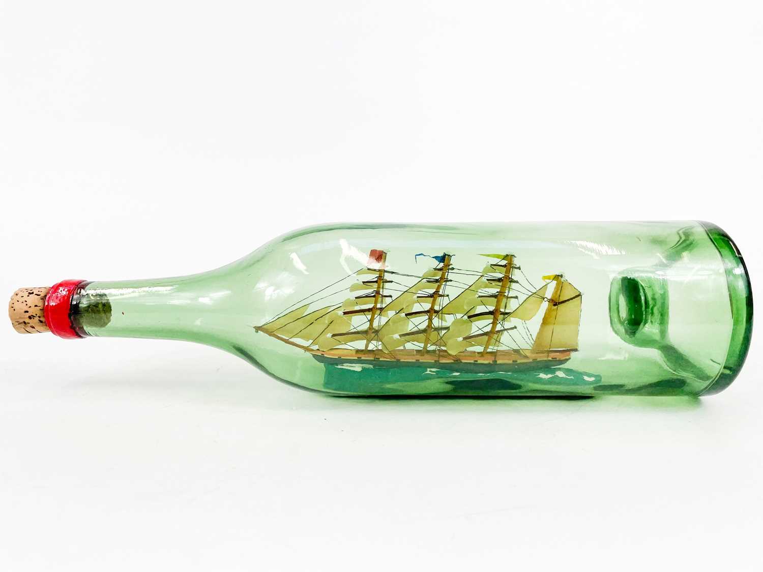 Lot 496 - A model ship in a bottle Loch Torridon 1881.