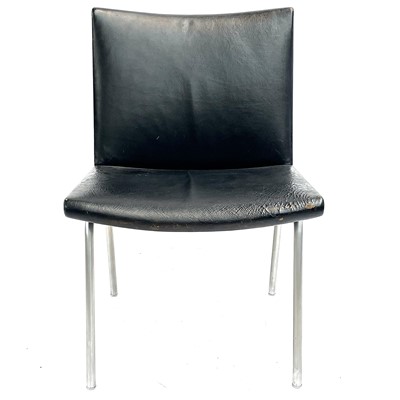 Lot 517 - After Hans J Wegner, a mid-century chrome-edged leather chair.