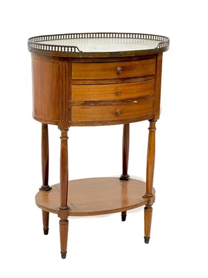 Lot 1807 - A French style mahogany oval marble top bedside table with pierced brass gallery.