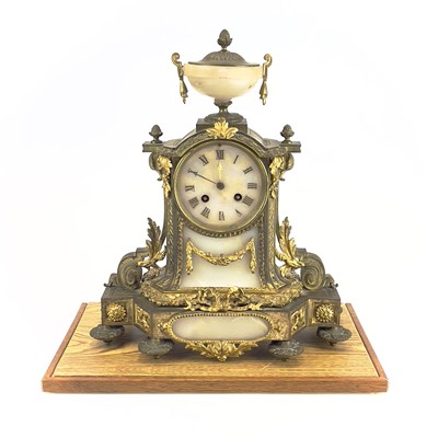 Lot 1718 - A French gilt metal and alabaster eight day mantel clock.