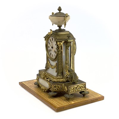 Lot 1718 - A French gilt metal and alabaster eight day mantel clock.