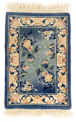 Lot 200 - Three Chinese rugs.