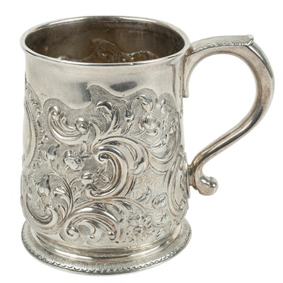 Lot 70 - A George II silver embossed mug by William Fordham or William Fleming.