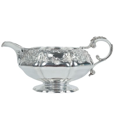 Lot 271 - A George IV silver embossed milk jug by William Bateman.