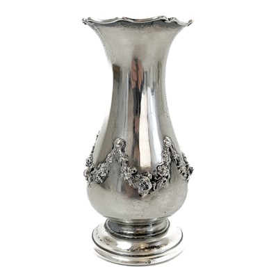 Lot 97 - A Victorian silver baluster vase moulded with floral swags by Daniel & John Wellby.