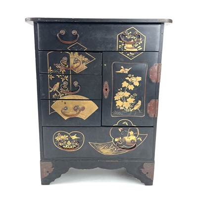 Lot 318 - A Japanese black lacquered small cabinet.