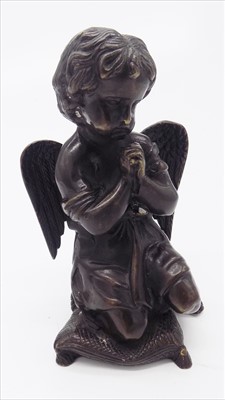 Lot 168 - A bronze figure of a praying cherub.
