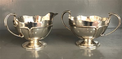 Lot 108 - An Edwardian Arts and Crafts silver twin...