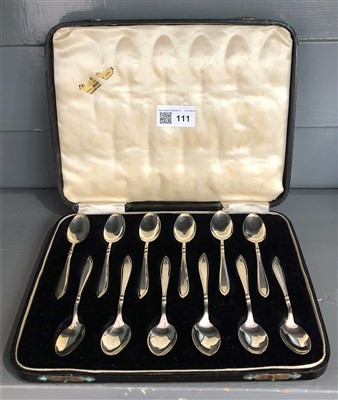 Lot 111 - A set of 12 pre-war silver coffee spoons, cased.