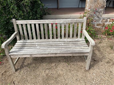 Lot 85 - A Teak garden bench.