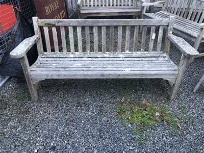 Lot 84 - A teak garden bench.
