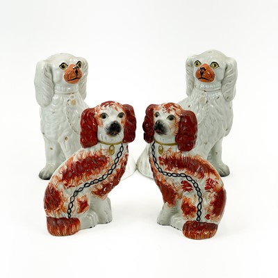 Lot 915 - A pair of Victorian Staffordshire spaniels.