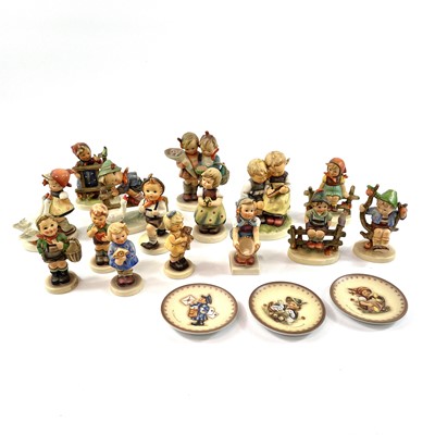 Lot 897 - A collection of fifteen Hummel porcelain figures.