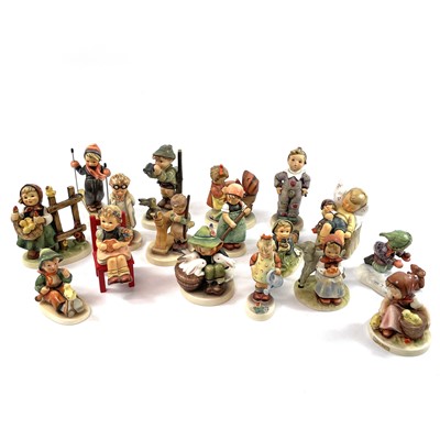 Lot 899 - A collection of seventeen Hummel porcelain figures.