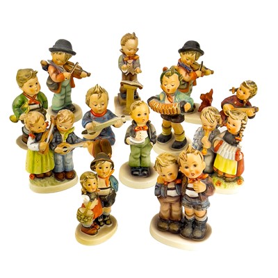 Lot 900 - A collection of twelve Hummel porcelain figures.