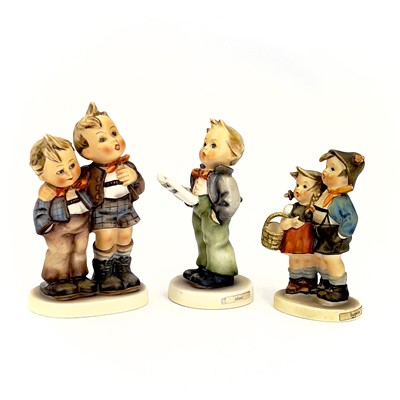 Lot 900 - A collection of twelve Hummel porcelain figures.