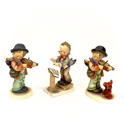 Lot 900 - A collection of twelve Hummel porcelain figures.