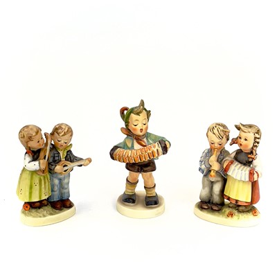 Lot 900 - A collection of twelve Hummel porcelain figures.