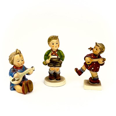 Lot 900 - A collection of twelve Hummel porcelain figures.