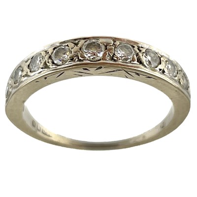 Lot 100 - A modern 18ct white gold diamond set nine stone half eternity ring.