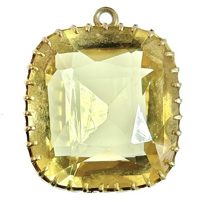 Lot 129 - A gold mounted citrine pendant.