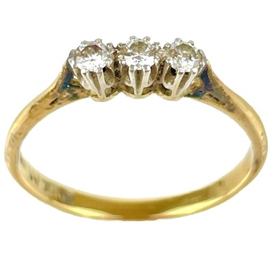 Lot 126 - An 18ct and platinum diamond three stone ring.