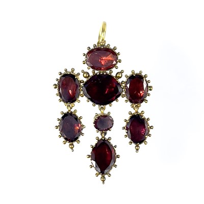 Lot 360 - A Georgian high purity gold foil back garnet pendant brooch.