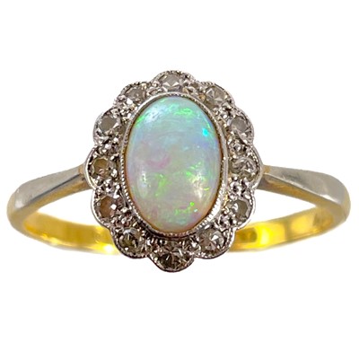 Lot 339 - An 18ct and platinum diamond and opal cluster ring.