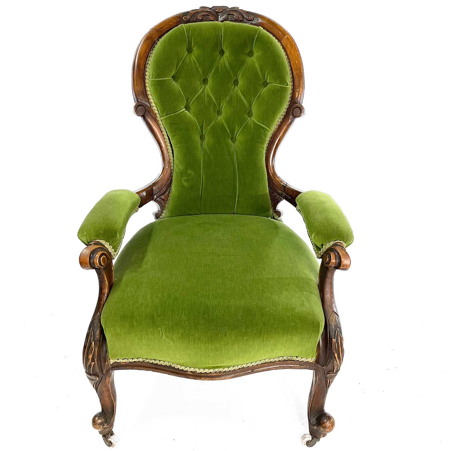 Lot 1910 - A Victorian walnut framed spoon back armchair.