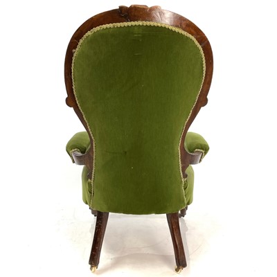 Lot 1910 - A Victorian walnut framed spoon back armchair.