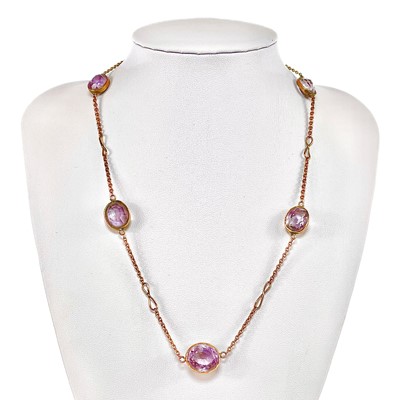 Lot 85 - A gold and amethyst necklace.