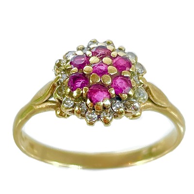 Lot 372 - A 9ct diamond and ruby cluster ring.