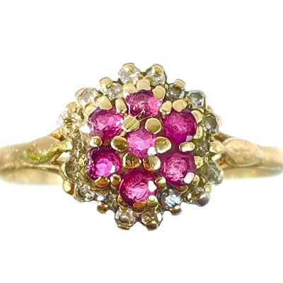 Lot 372 - A 9ct diamond and ruby cluster ring.