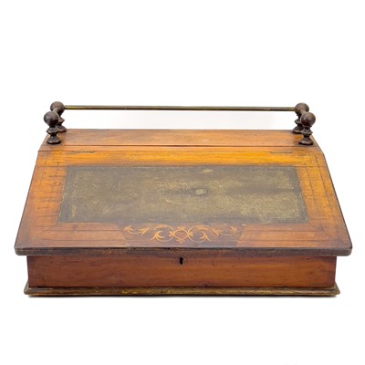 Lot 1925 - A Victorian walnut and inlaid table top desk.