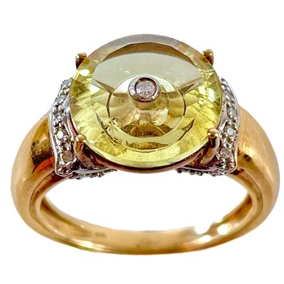 Lot 562 - A Glenn Lehrer 9ct gold diamond and citrine set Torusring ring.