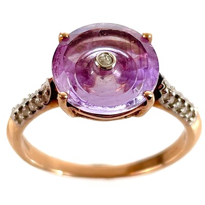 Lot 548 - A Glenn Lehrer 9ct rose gold amethyst and diamond Torusring ring.