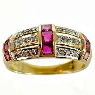 Lot 206 - A modern 18ct diamond and ruby set band ring.