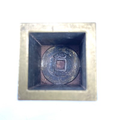 Lot 309 - A Chinese brass seal cube.