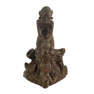 Lot 283 - A Balinese carved wood figure of female figures, early-mid 20th century.