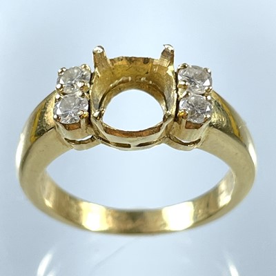 Lot 205 - An 18ct ring set with four round diamonds, the main stone missing.