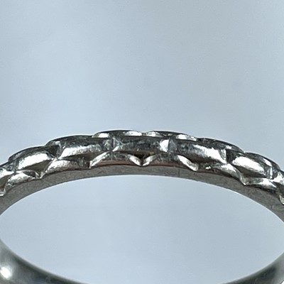 Lot 366 - A platinum (tested) diamond solitaire ring and a platinum (tested) band ring.
