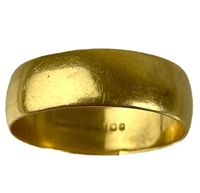 Lot 243 - An 18ct hallmarked gold band ring.