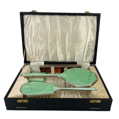 Lot 3 - An George VI Art Deco silver green guilloche enamel cased four piece dressing table set.