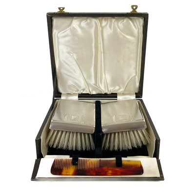 Lot 205 - A George VI silver engine turned cased pair of gents brush set by Deakin & Francis.