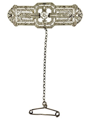 Lot 128 - An Art Deco gold and platinum diamond set panel brooch.