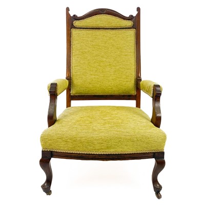 Lot 1900 - An Edwardian upholstered walnut open armchair.