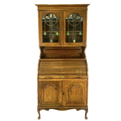 Lot 1813 - An English Art Nouveau oak bureau bookcase.