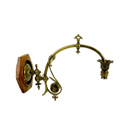 Lot 126 - A brass and teak gas wall light bracket.