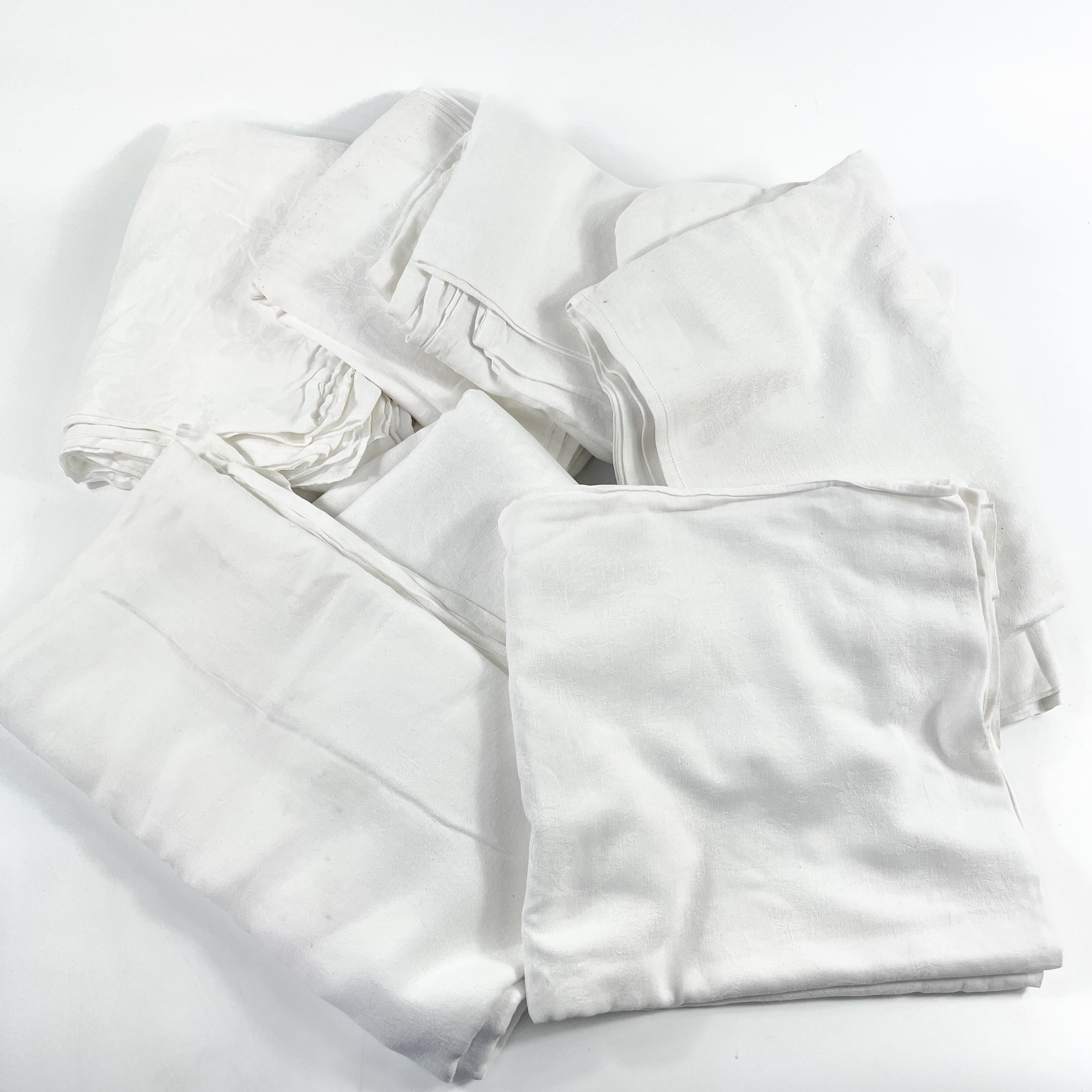 Lot 1608 Seven Damask white table linens.